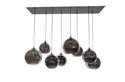 Hanglamp voor boven de eettafel met bollen van smoke glas